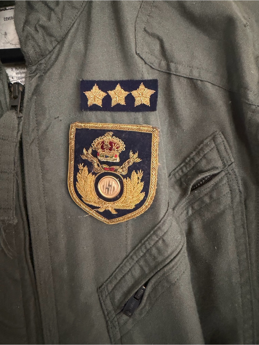 Olive Green Military-Style Pantsuit Jacket with Gold Crest Detail. Bull yarn